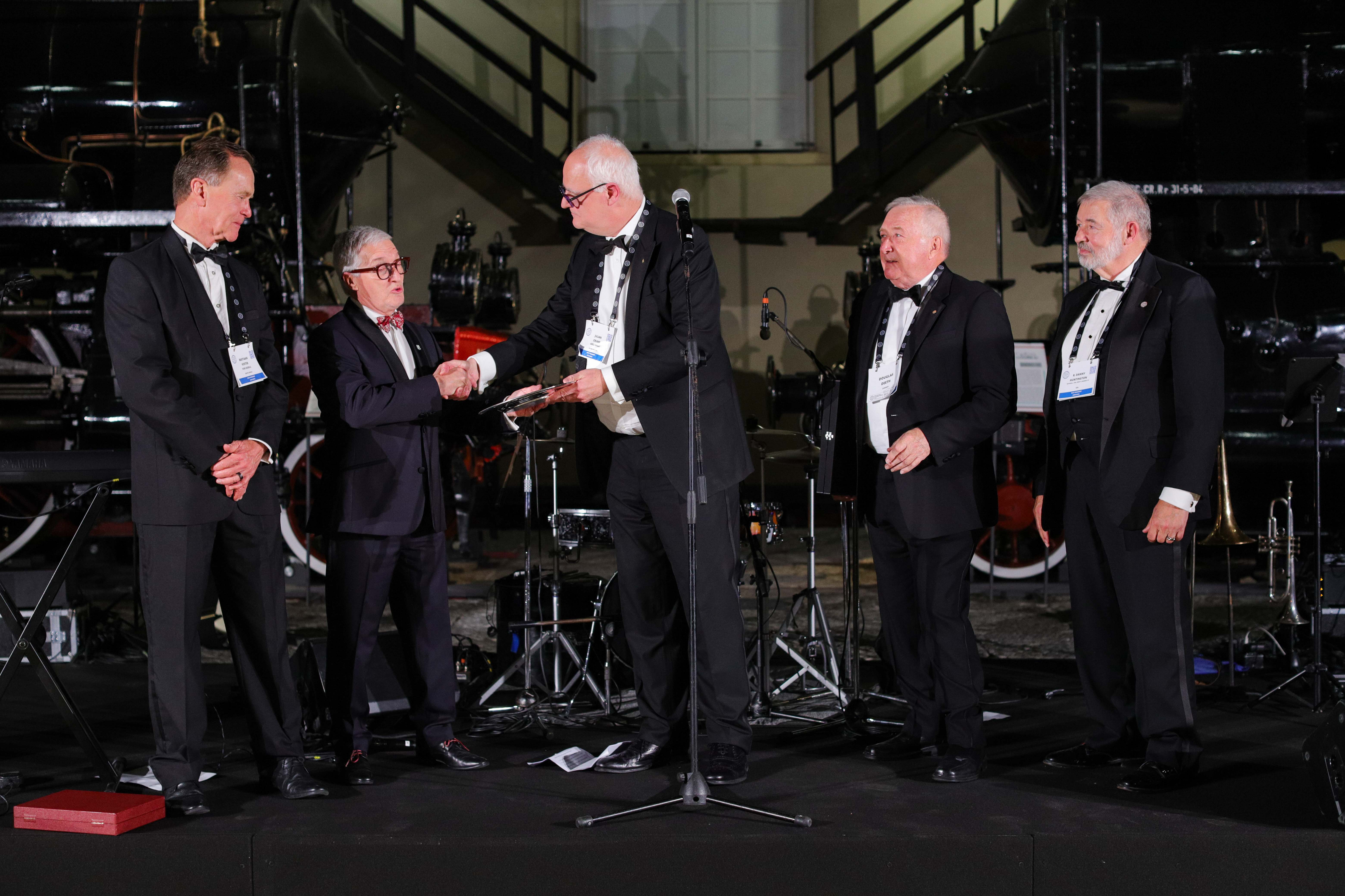 Five men in dinner suits